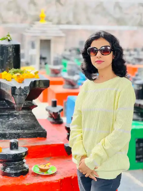 Ayan Malik girl stand wear black glasses with light shirt